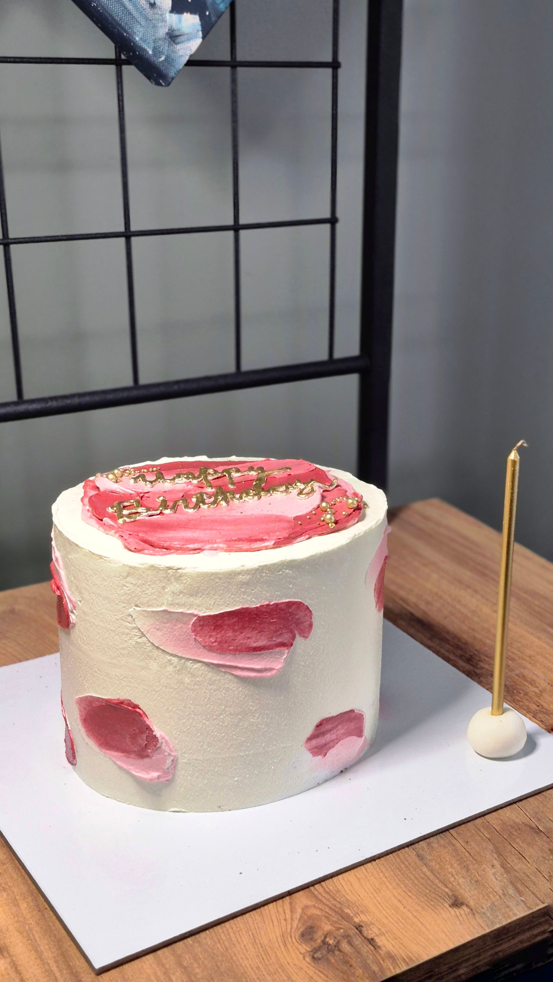 Pink buttercream celebration cake with gold details